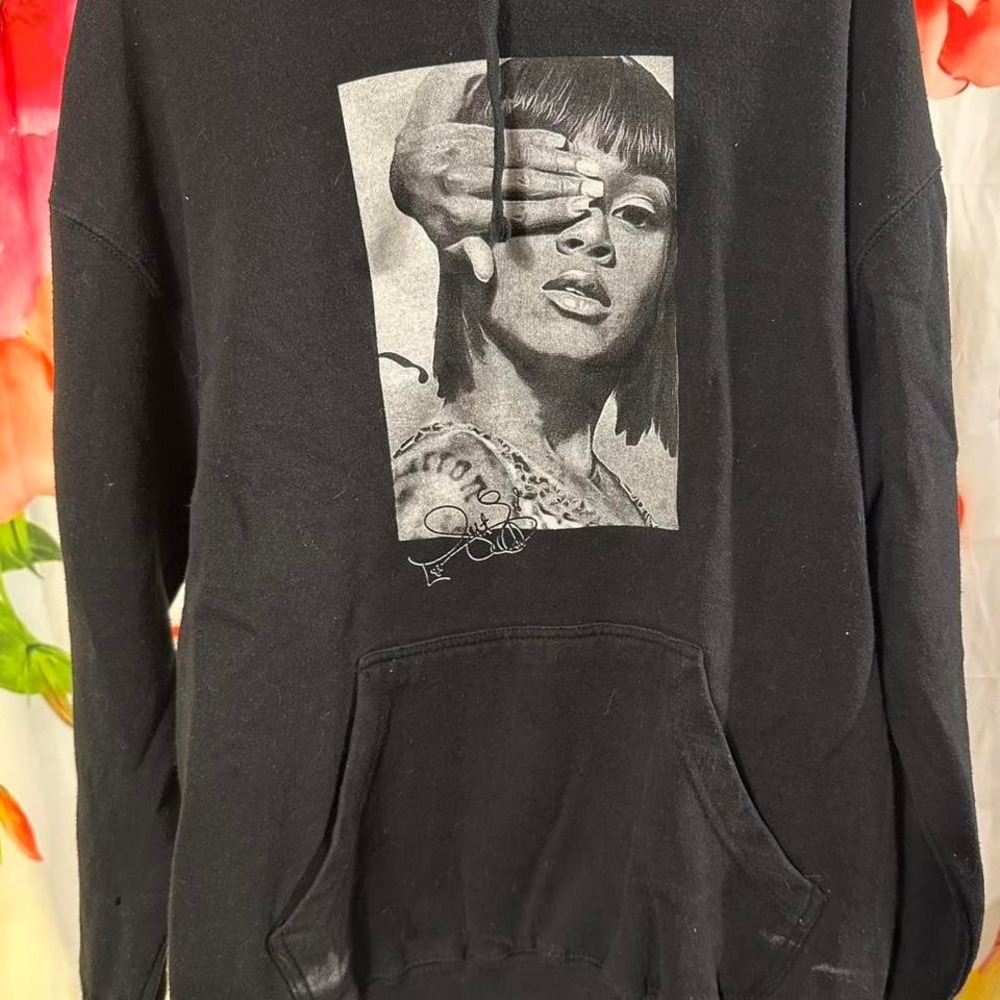 B 42. Black Rihanna hoodie with white accents Size M